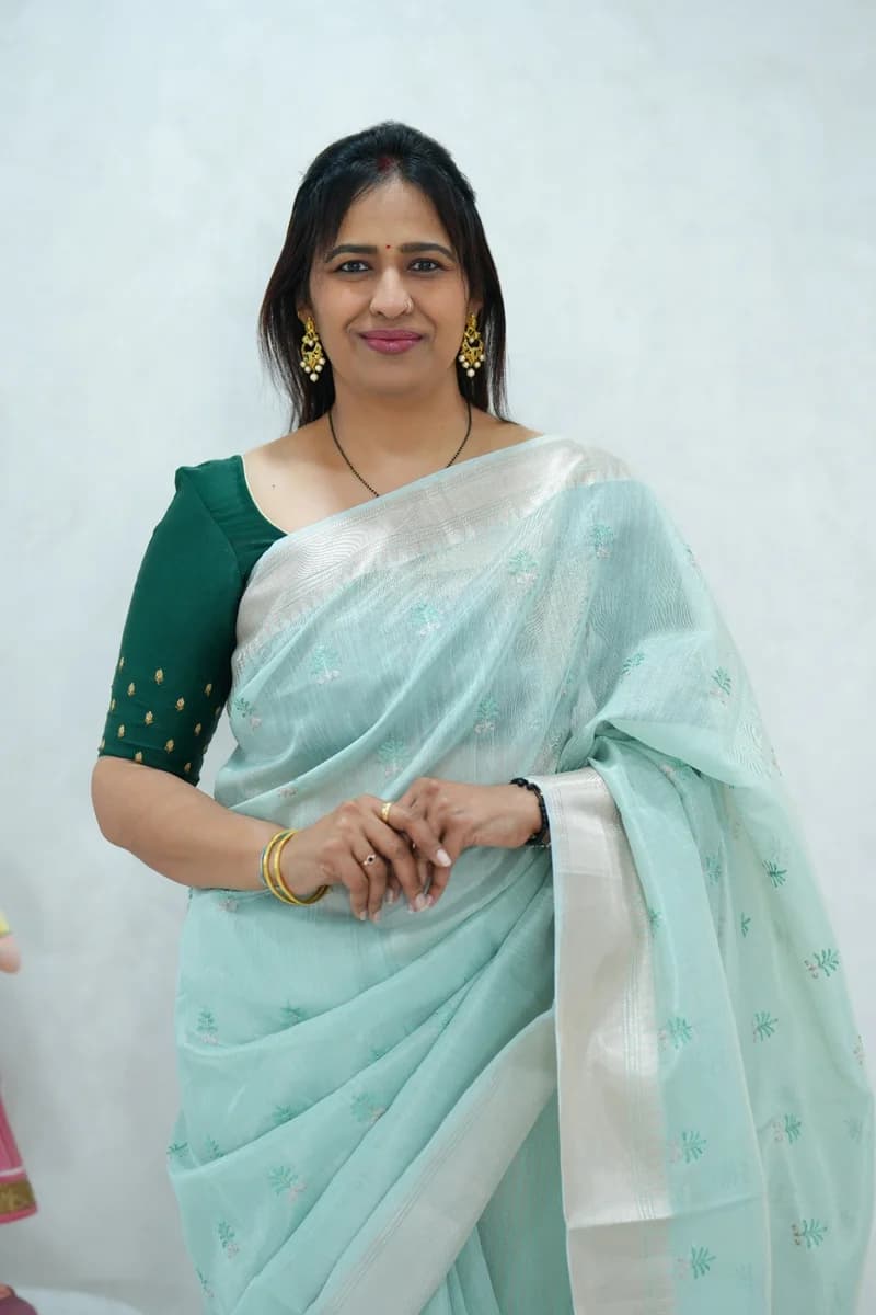 Lenin tissue saree in light blue with zari woven border and thread buttas, rich zari striped pallu with blouse