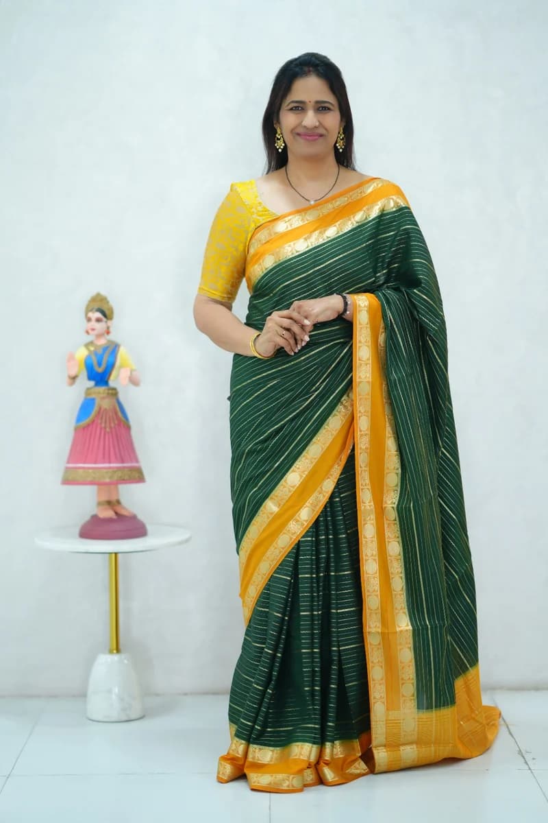 Crepe silk saree in green and mustard yellow combination